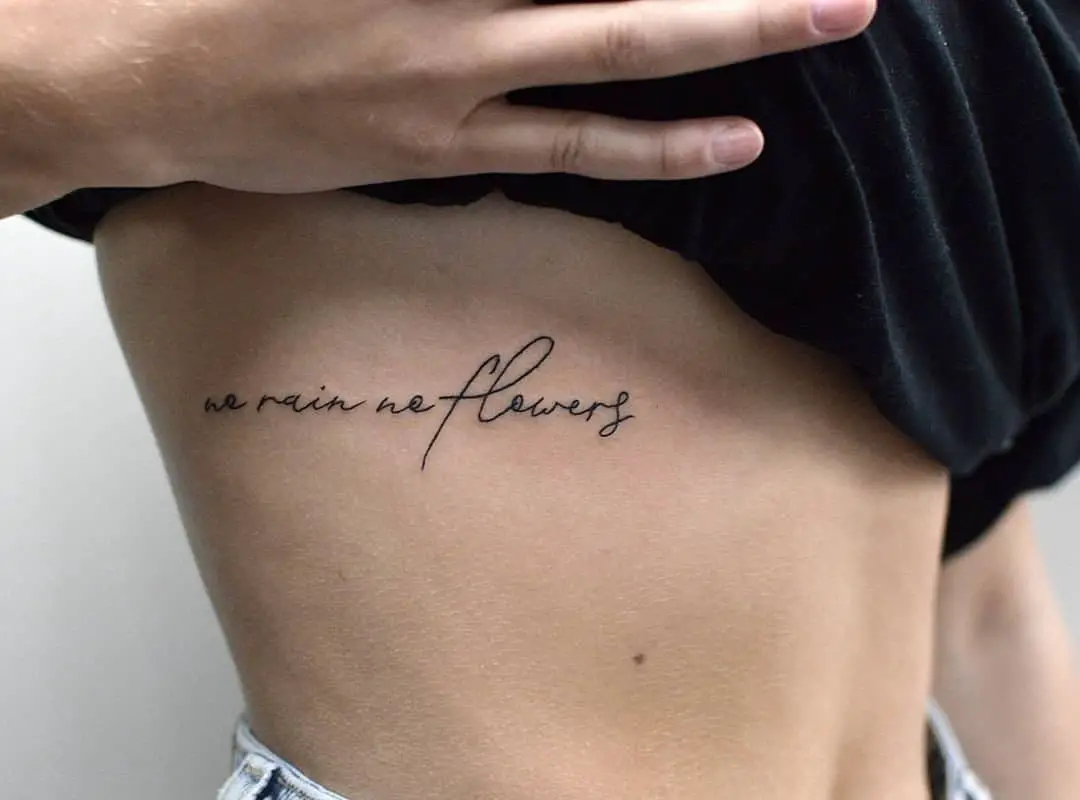 "no rain no flower" rib tattoo