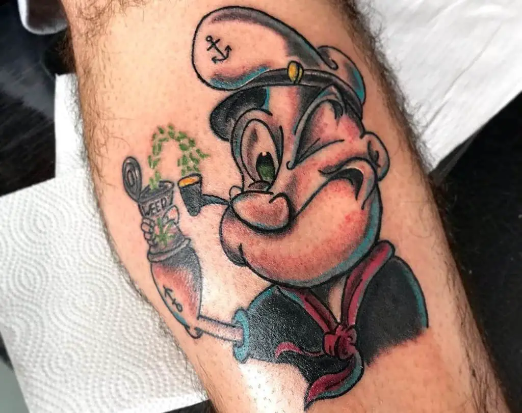 A tattoo of a Popeye sailor smoking a pipe