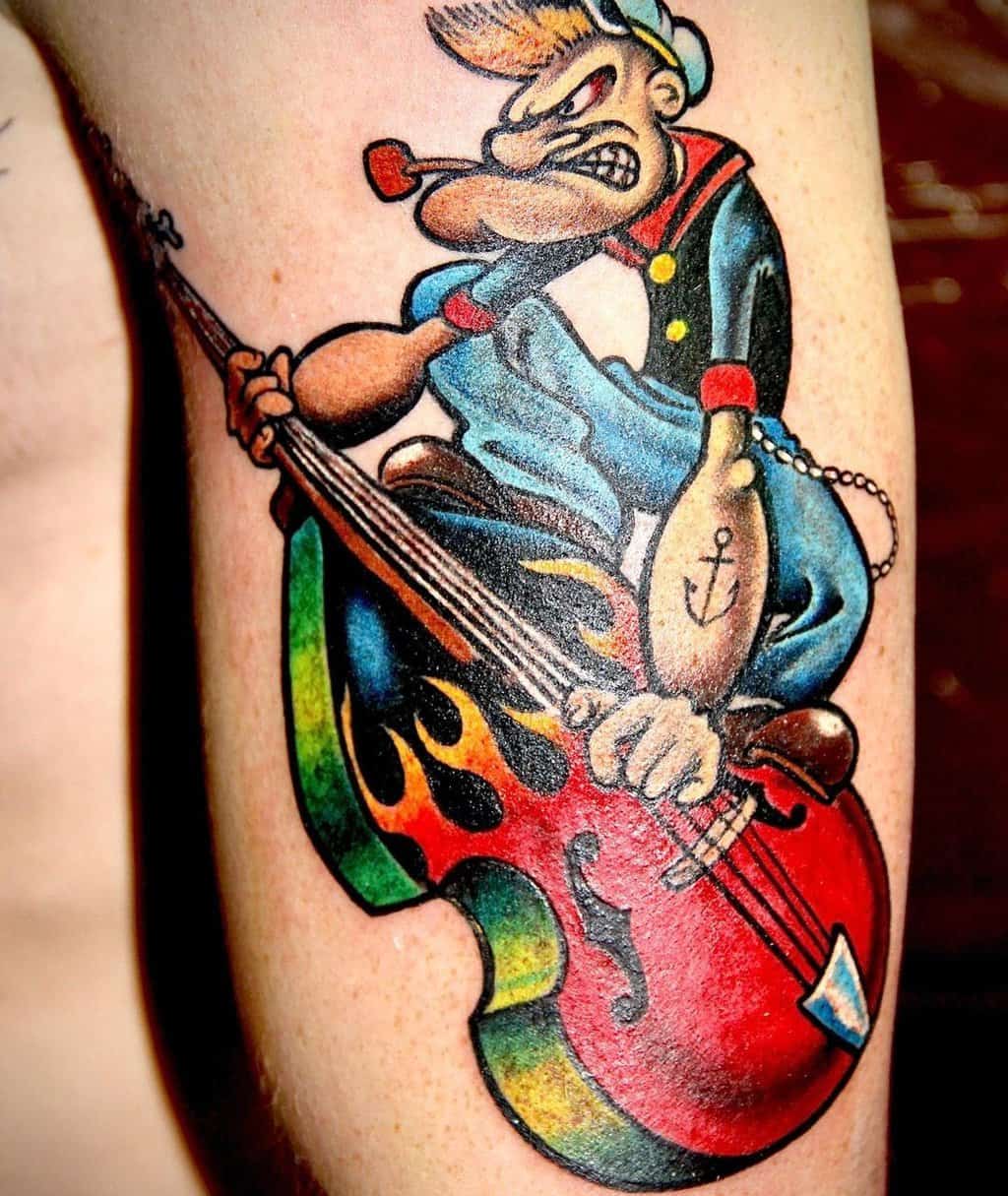 A tattoo of a Popeye sailor playing the double bass