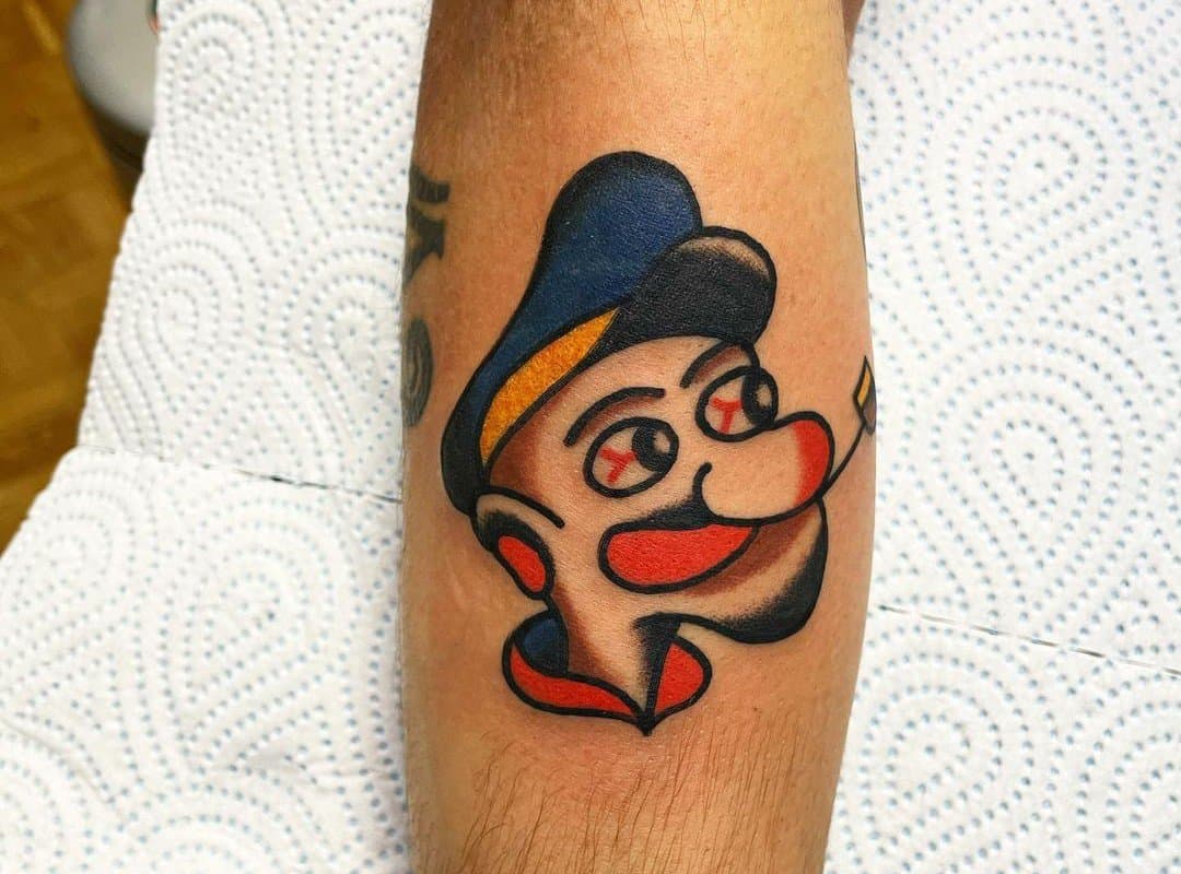 Popeye sailor tattoo with red eyes