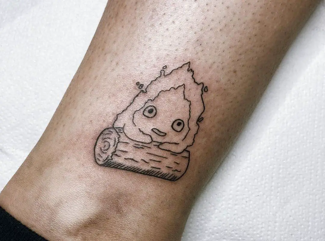 A small Calcifer tattoo on the ankles