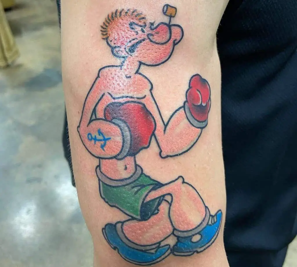 A tattoo of a boxing sailor Popeye 