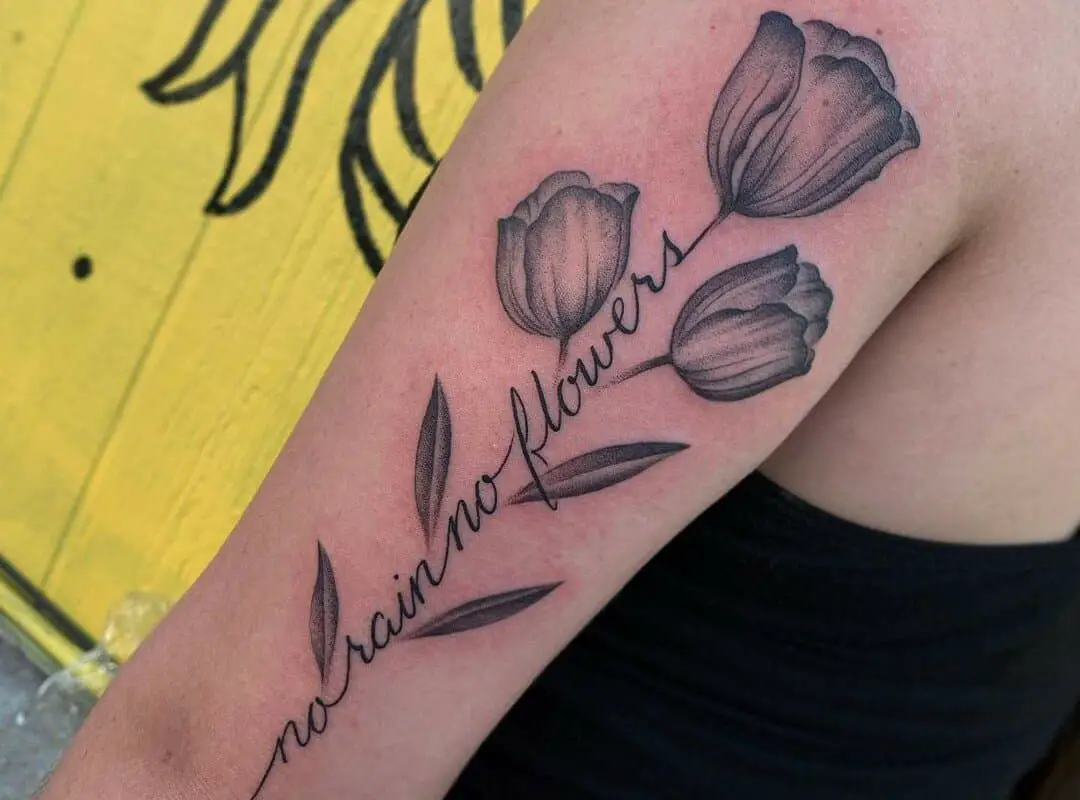 Flower tattoo along the forearm