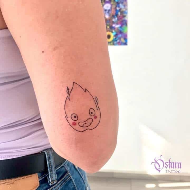 Calcifer fire tattoo on the elbow
