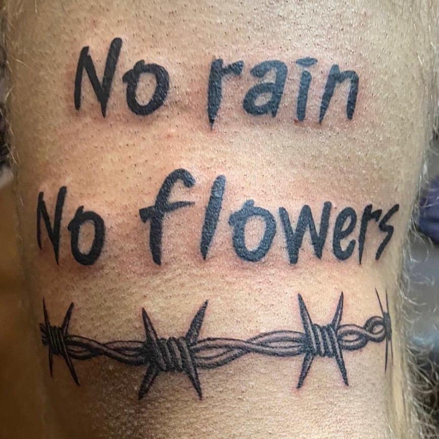 "no-rain-no-flower" motivational tattoo