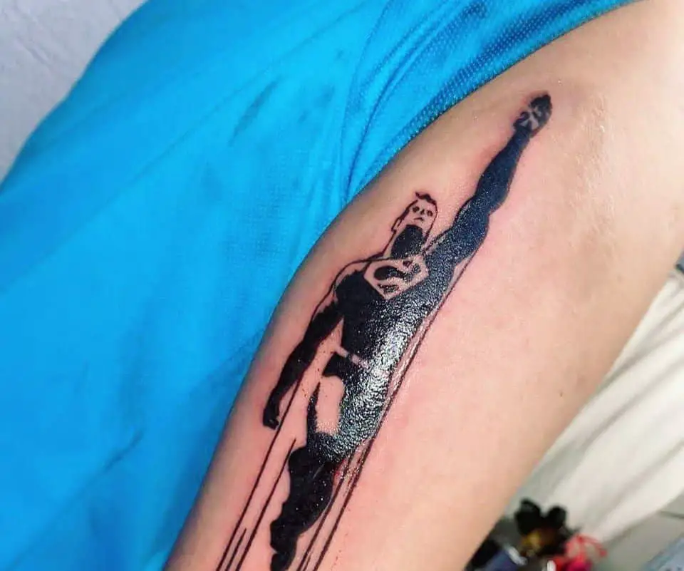 tattoo of superman flying in a classic pose