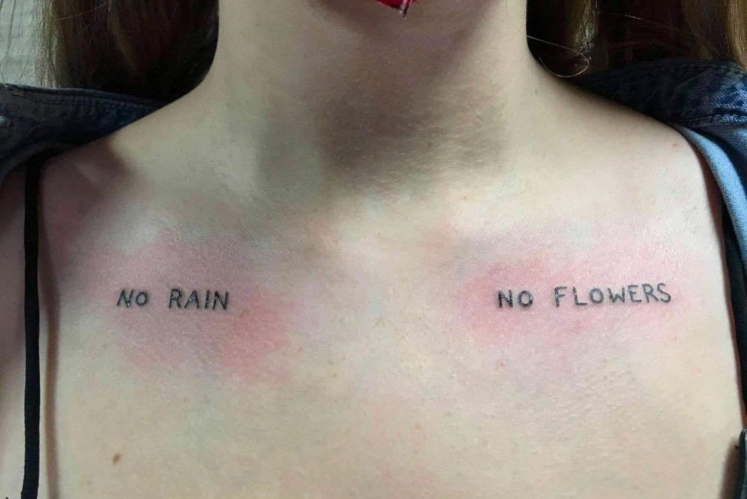 "no rain no flowers" tattoo on the collarbone