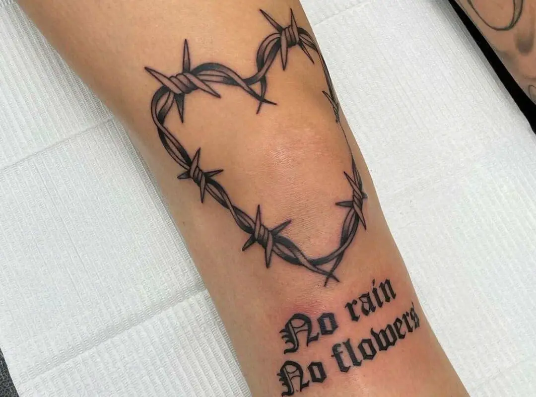 barbed wire heart tattoo and inscription