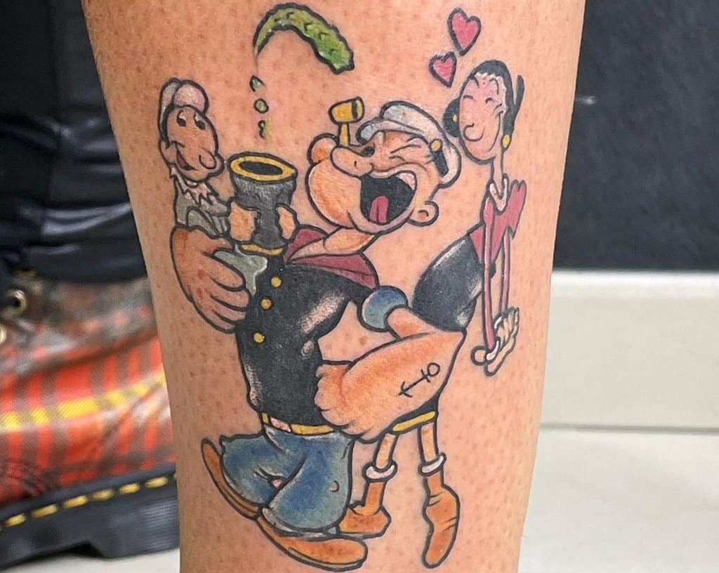 A tattoo of a Popeye sailor who eats spinach