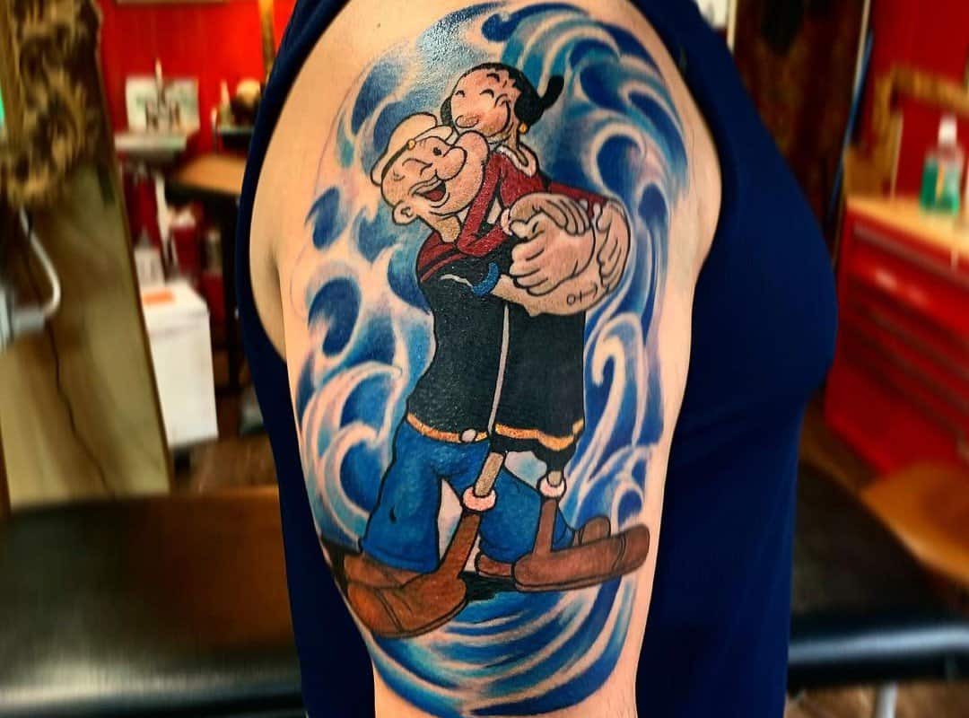 Popeye sailor tattoo on a background of waves