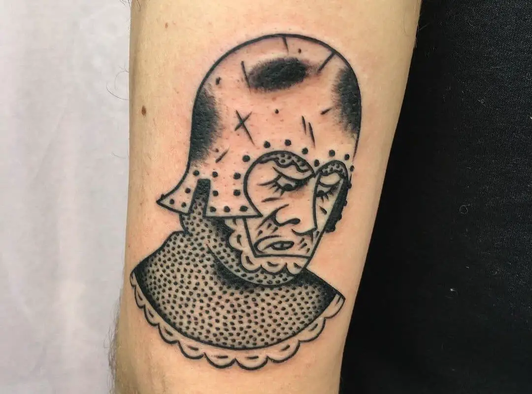  Tattoo of a knight's head with a helmet