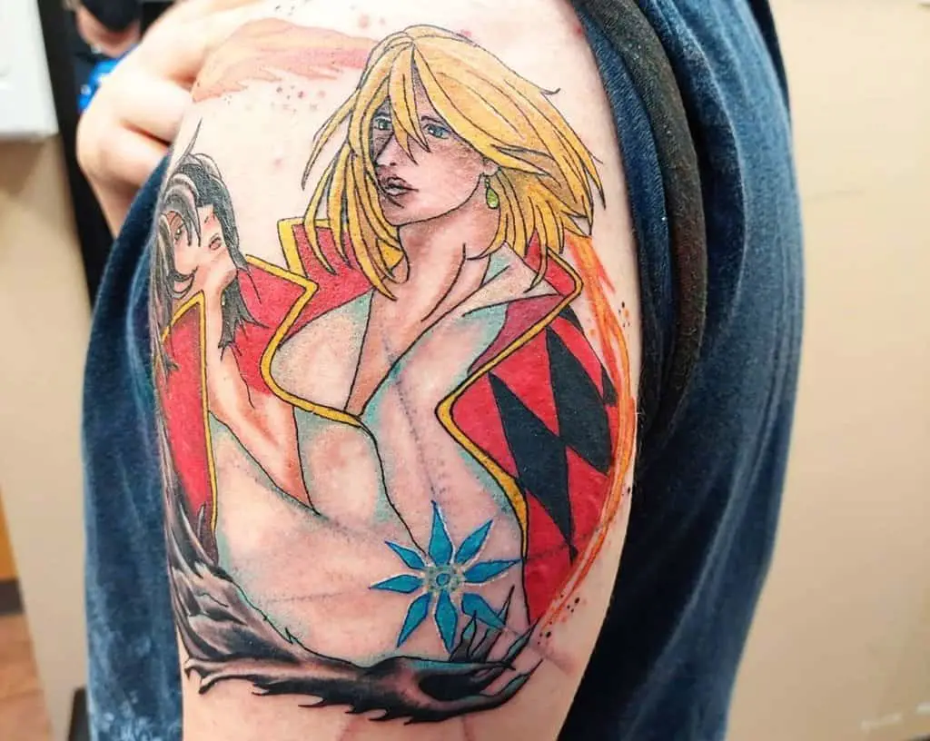 colored howl tattoo on the shoulder