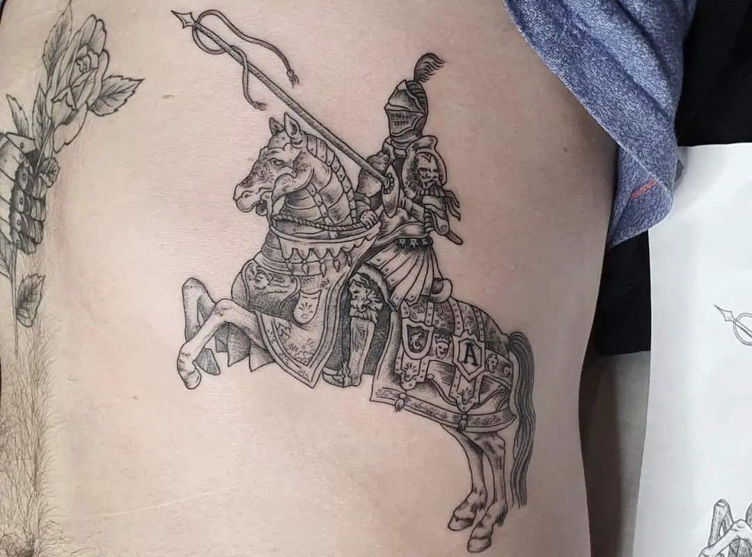 A tattoo of a knight on a horse with a spear 