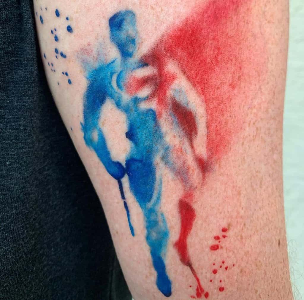 tattoo of a red and blue silhouette of Superman