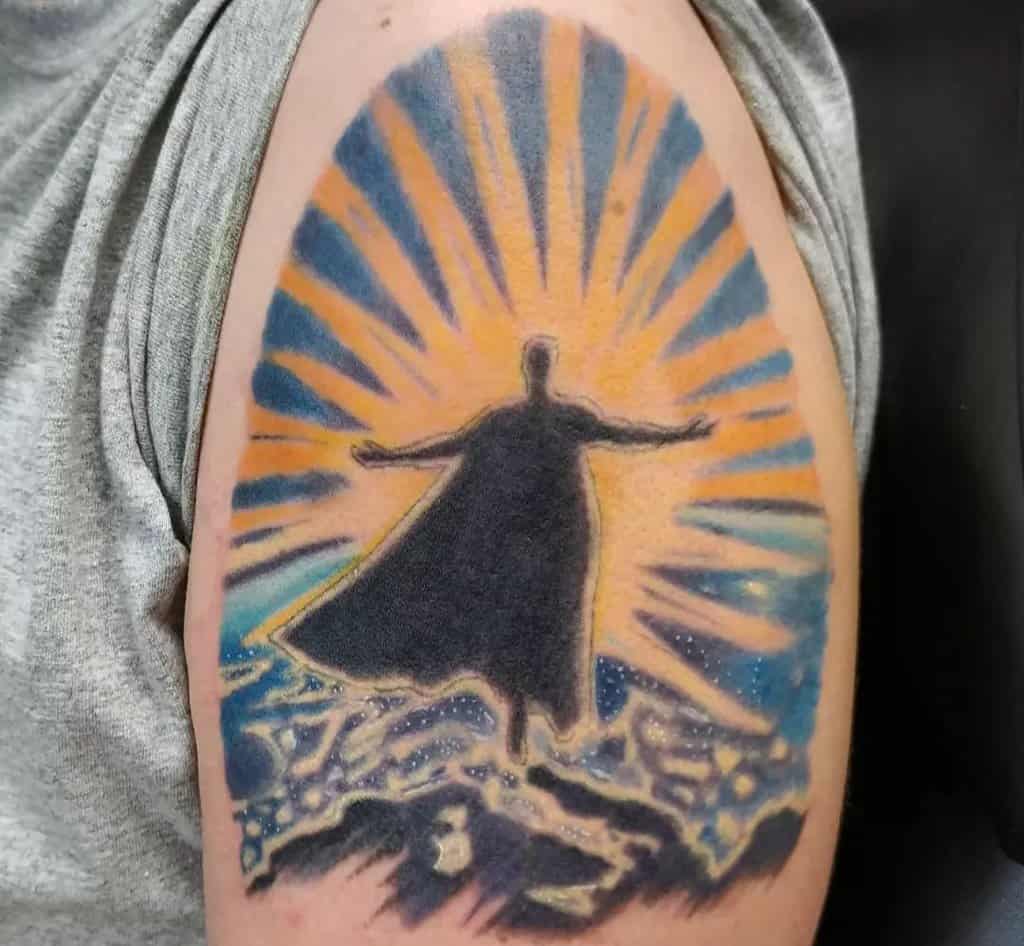 superman tattoo with the sun in the background