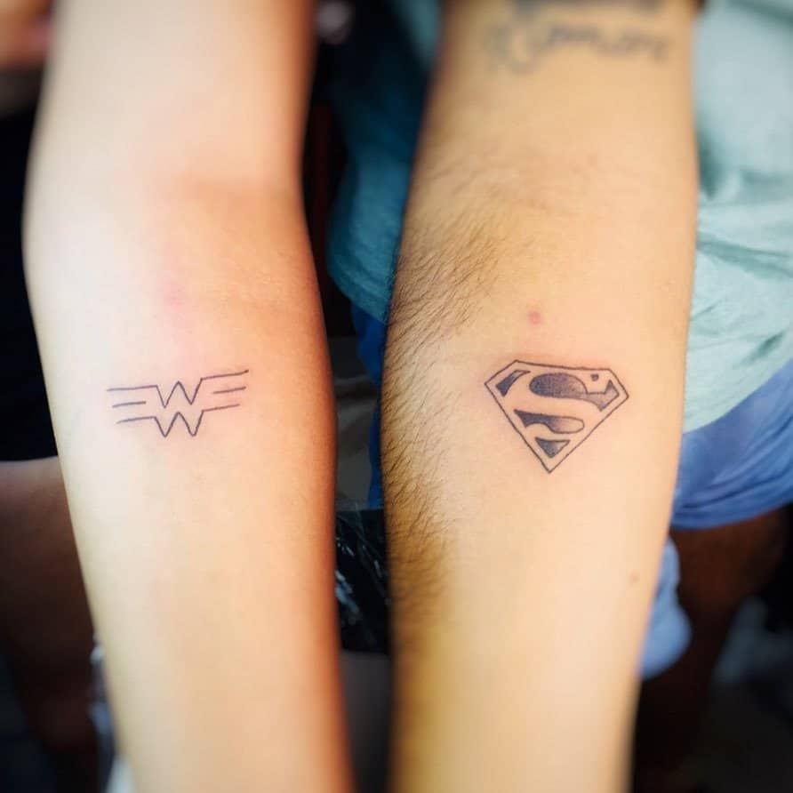 Superman and Wonder Woman logo tattoo