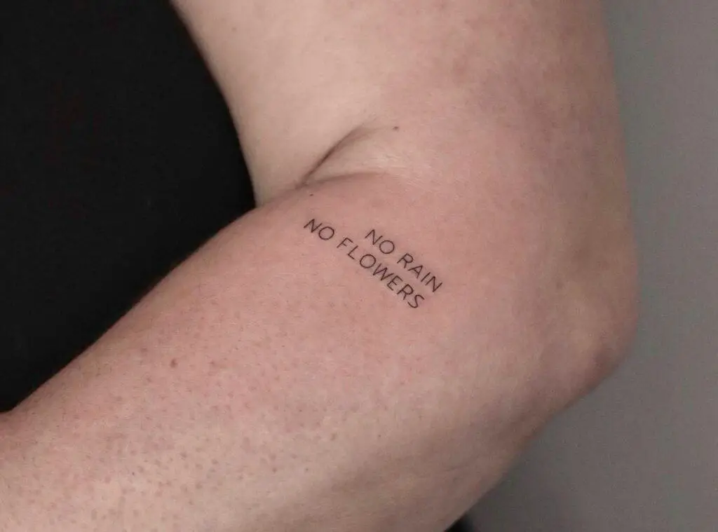a tattoo of a small inscription with great meaning