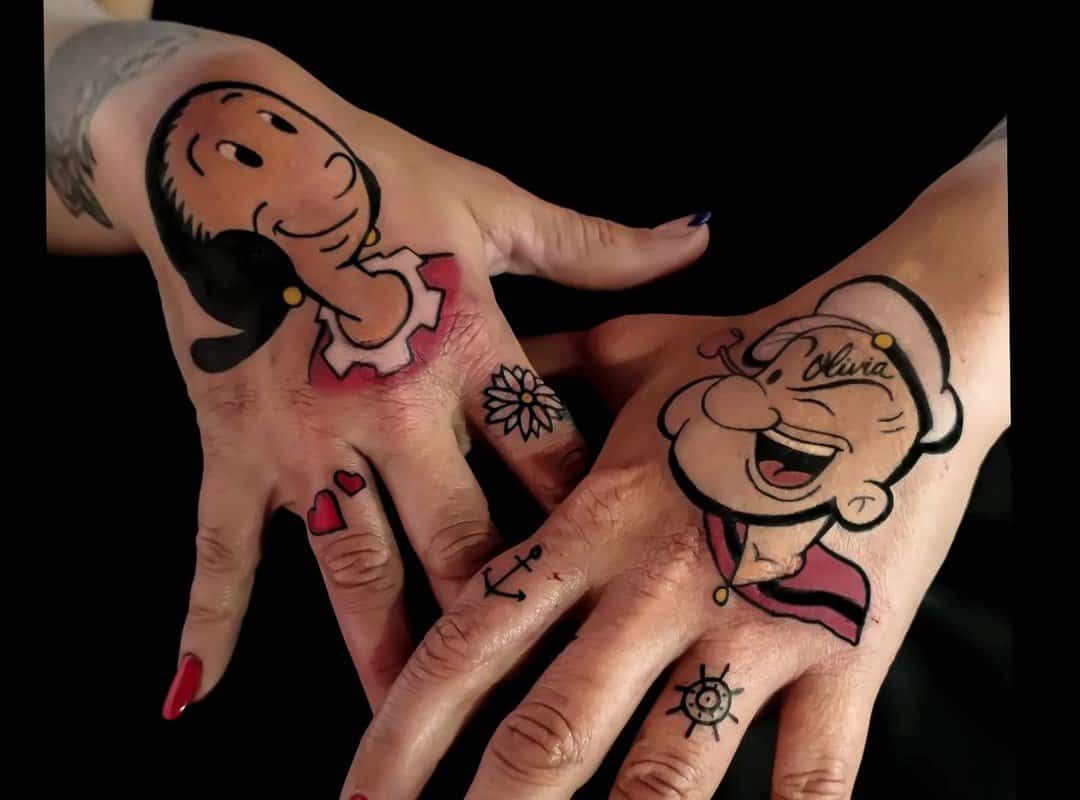 Popeye sailor tattoo on a girl's hands