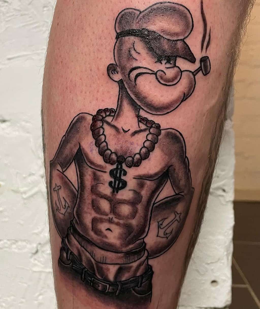 a sailor popeye tattoo with a naked torso