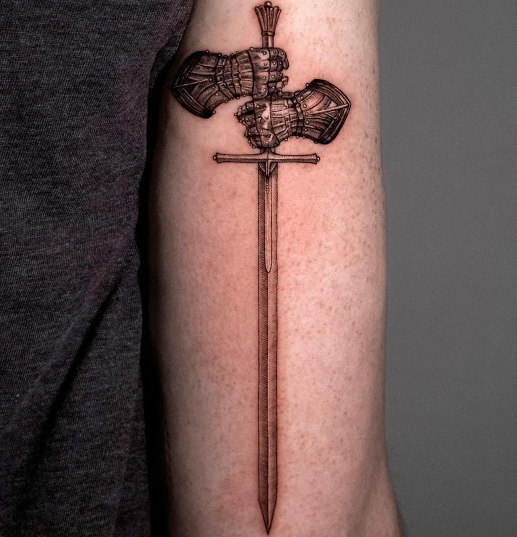 Tattoo of a two-handed sword in hand