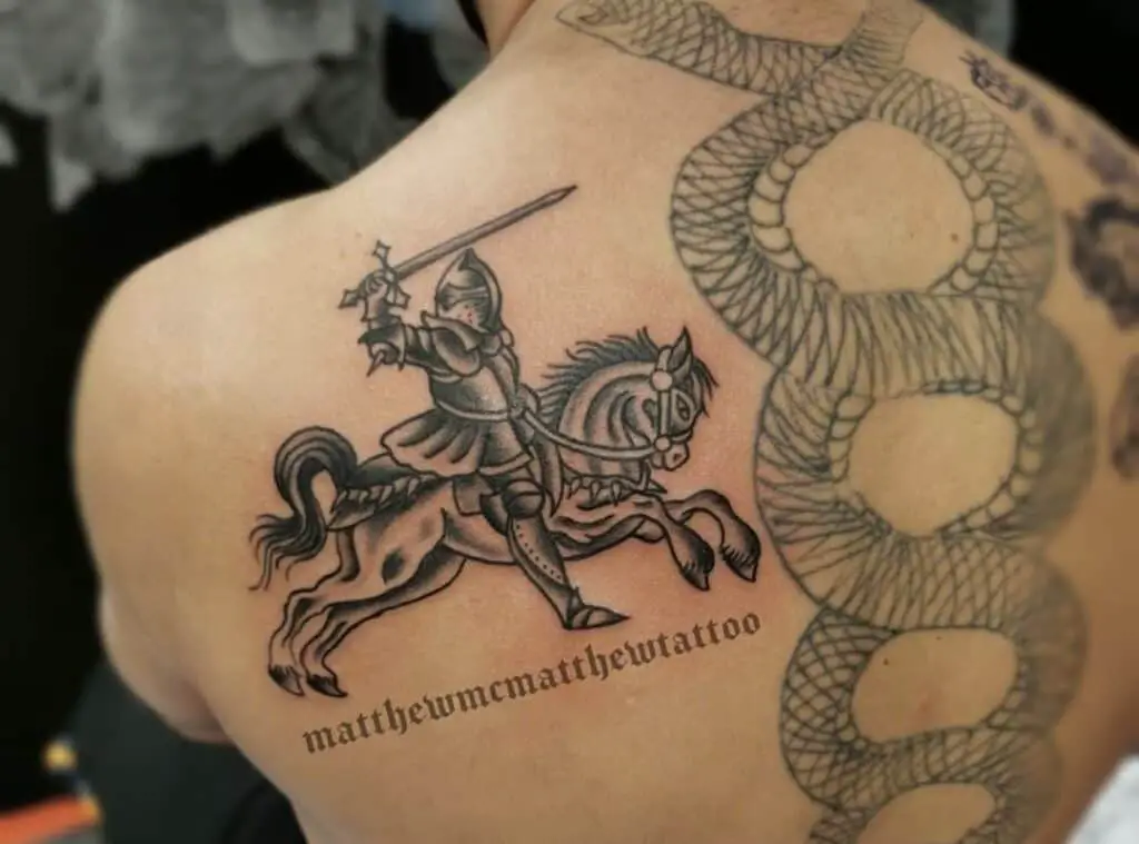 Tattoo of a knight on a horse with a sword in his hand