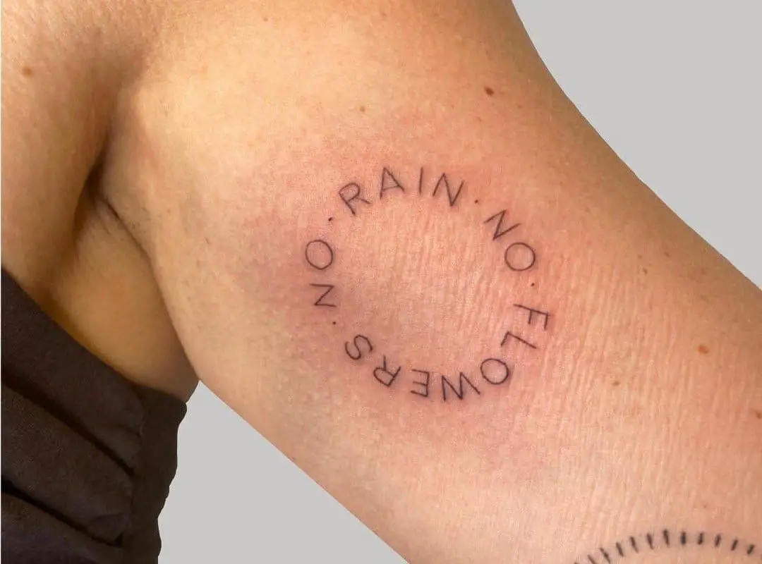 Close-up tattoo of the inscription