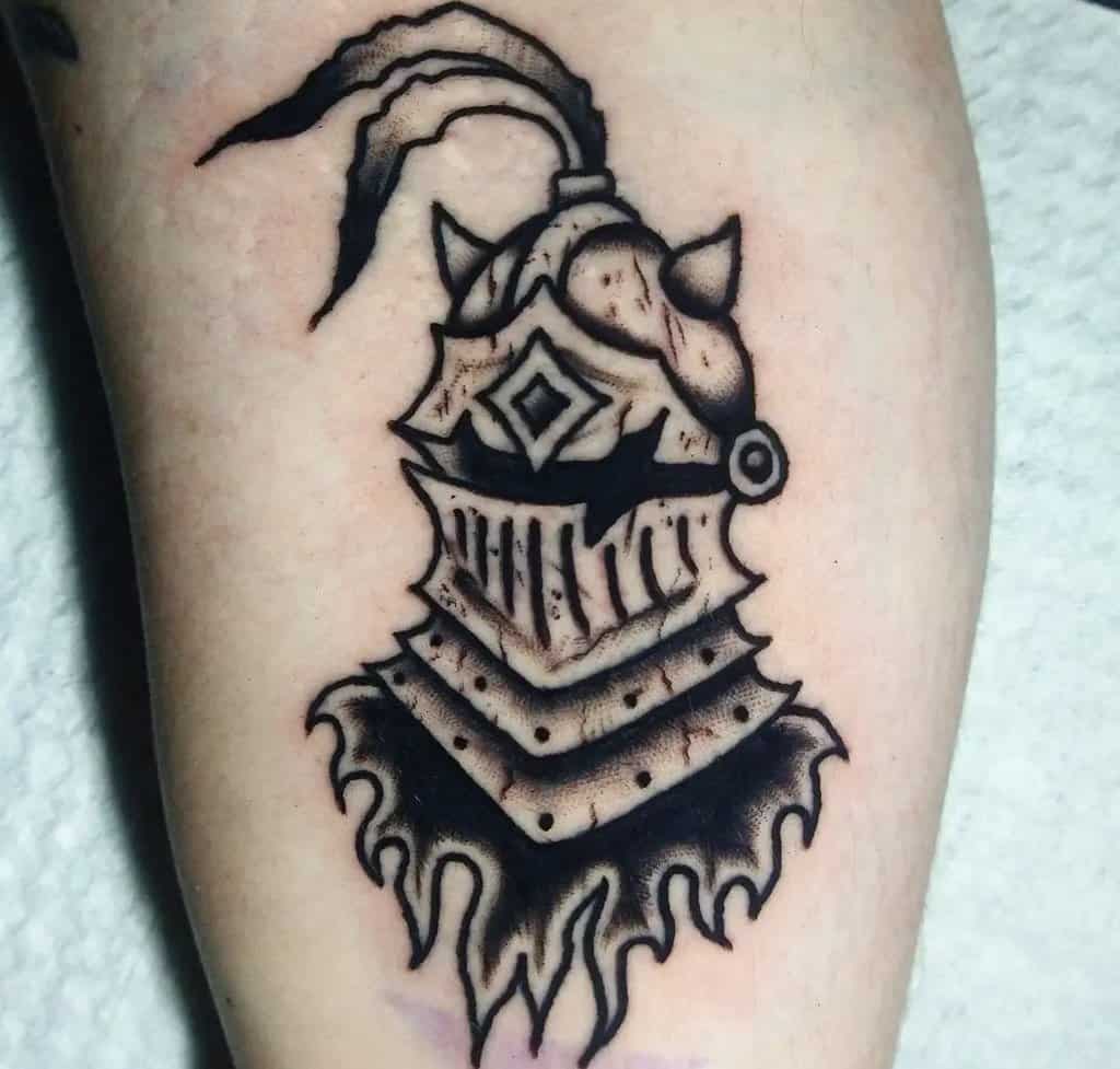 Tattoo of a helmet with a feather