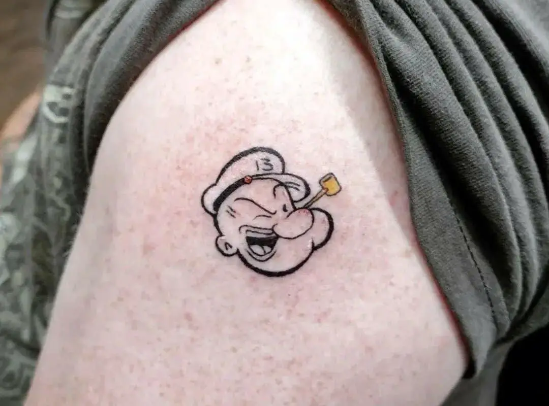 minimalist Popeye sailor tattoo on the shoulder