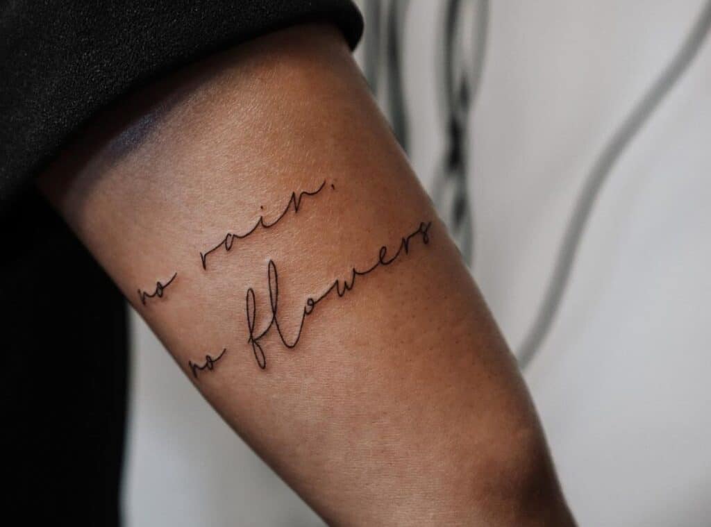 tattoo "no rain no flowers" in a beautiful font