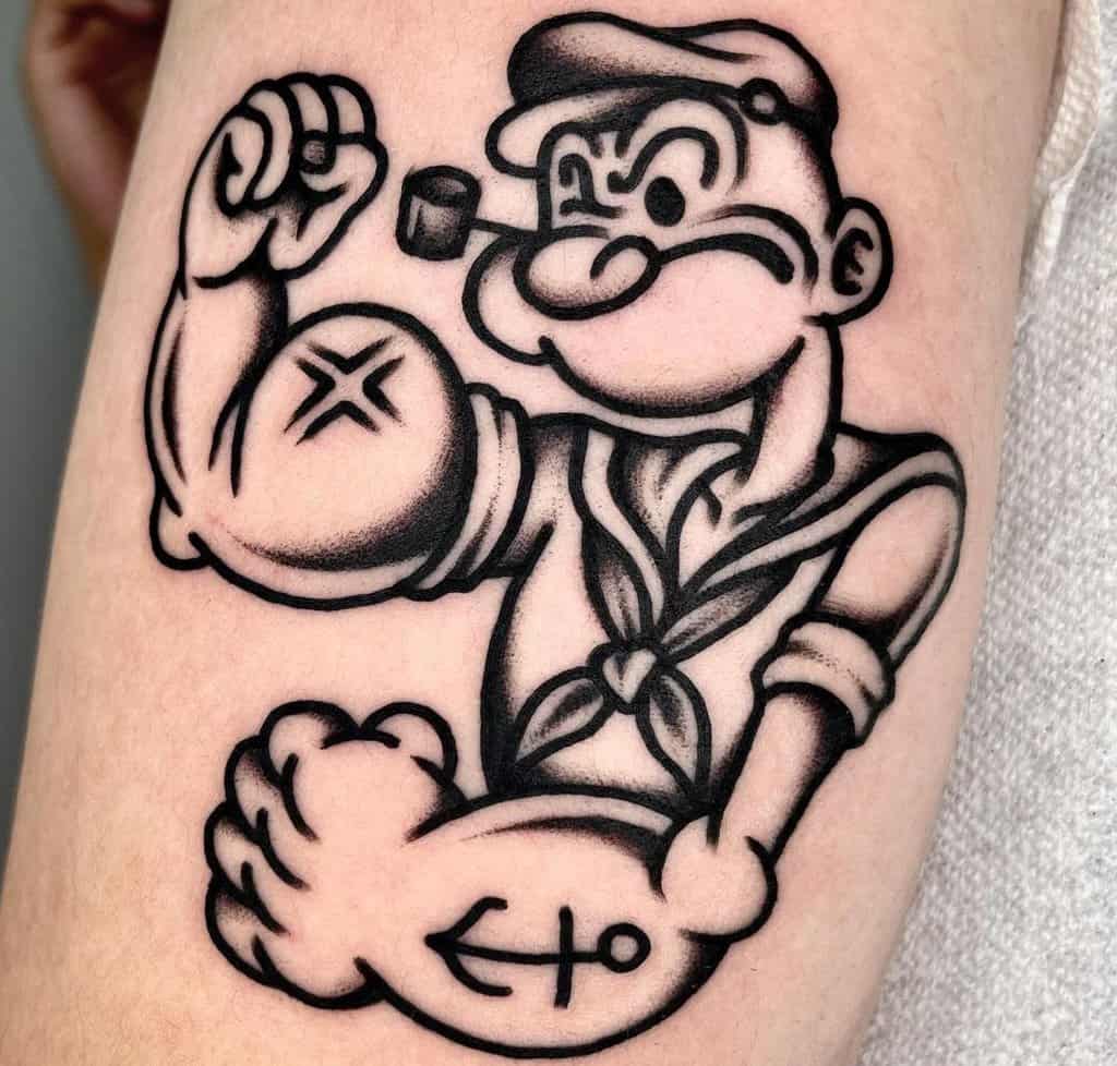 A tattoo of a Popeye sailor showing his biceps