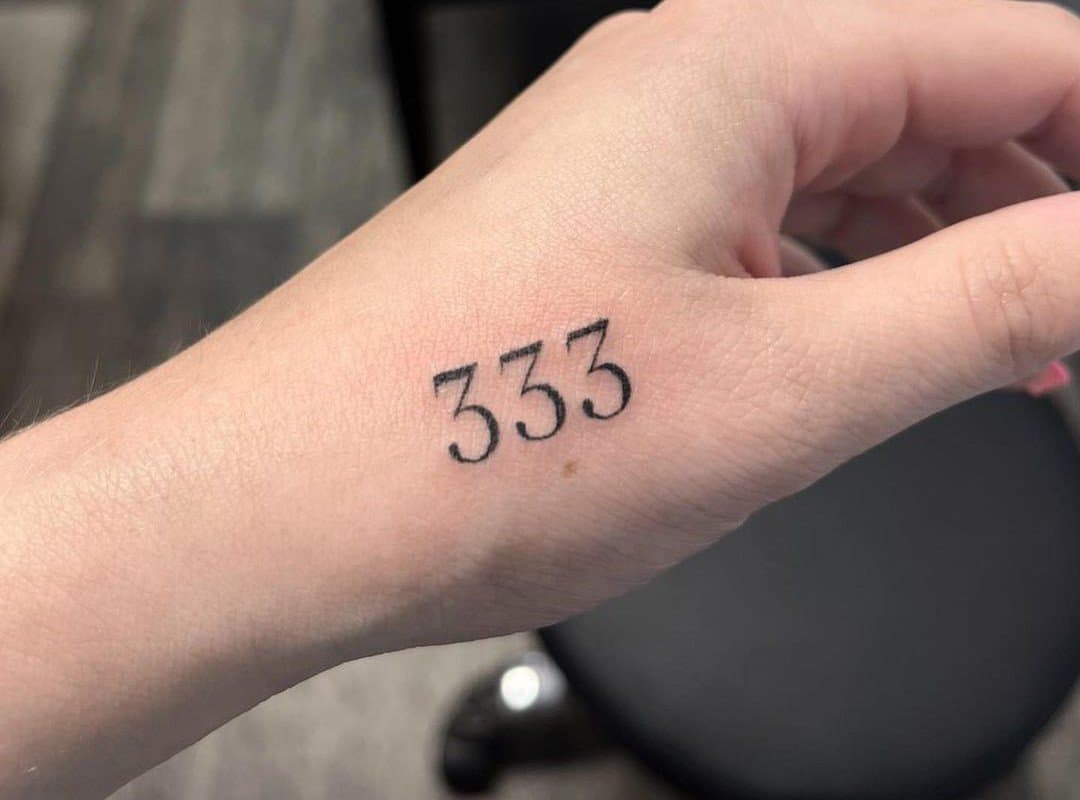 333 tattoo on the thumb