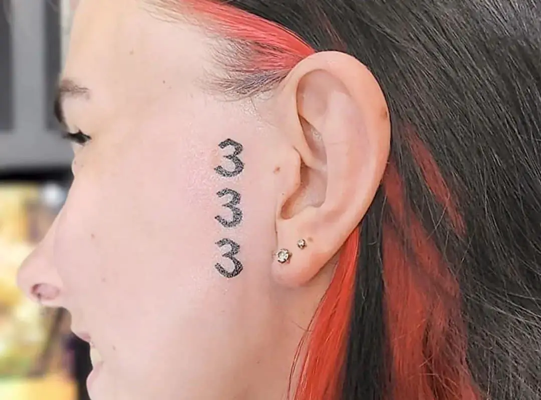 333 tattoo near the ear
