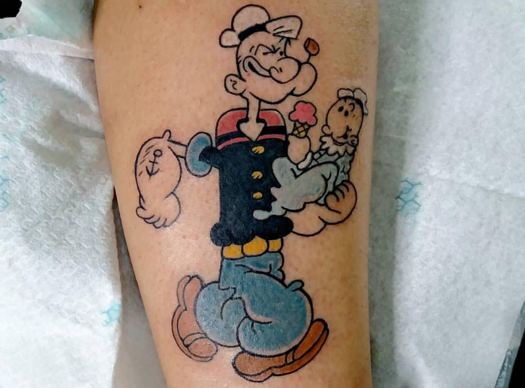 tattoo of a Popeye sailor with a baby
