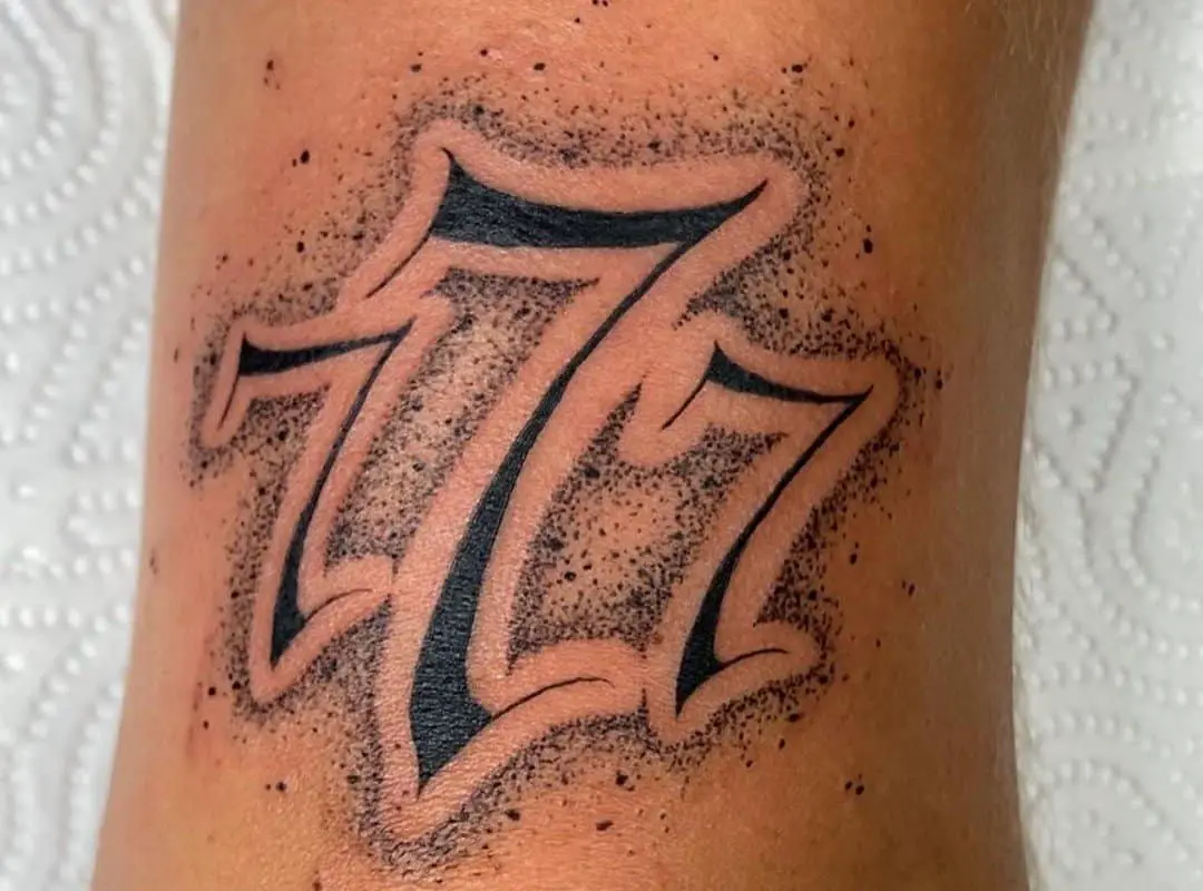 777 tattoo in old english font