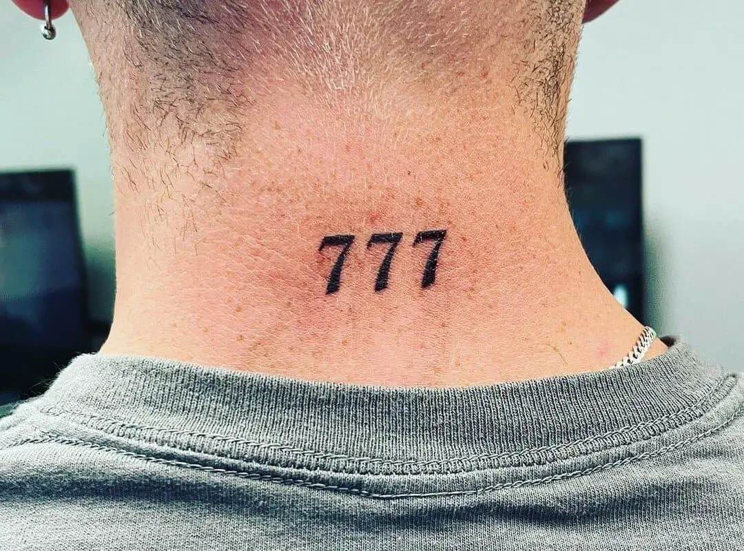 777 tattoo below the back of the head