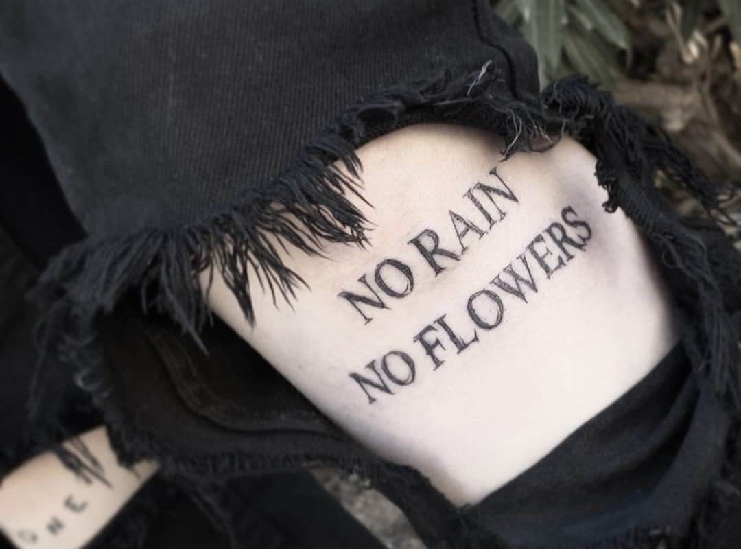 no rain no flowers tattoo under clothes