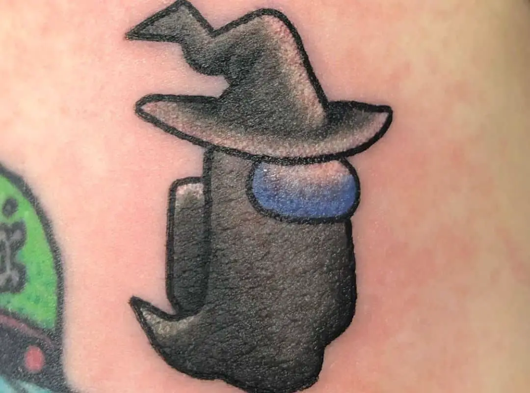 Black impostor in a witch hat tattoo