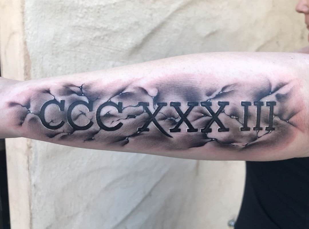 CCCXXXIII arm tattoo