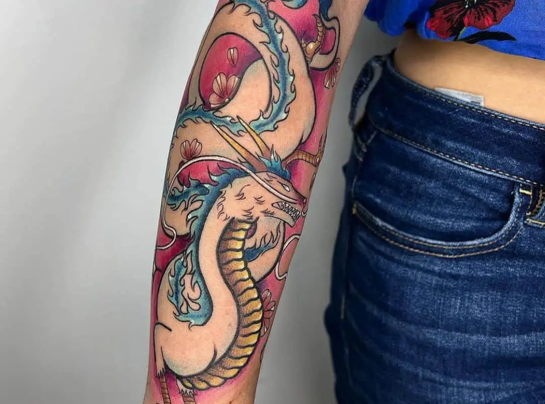 Scary Haku dragon on the pink background tattoo