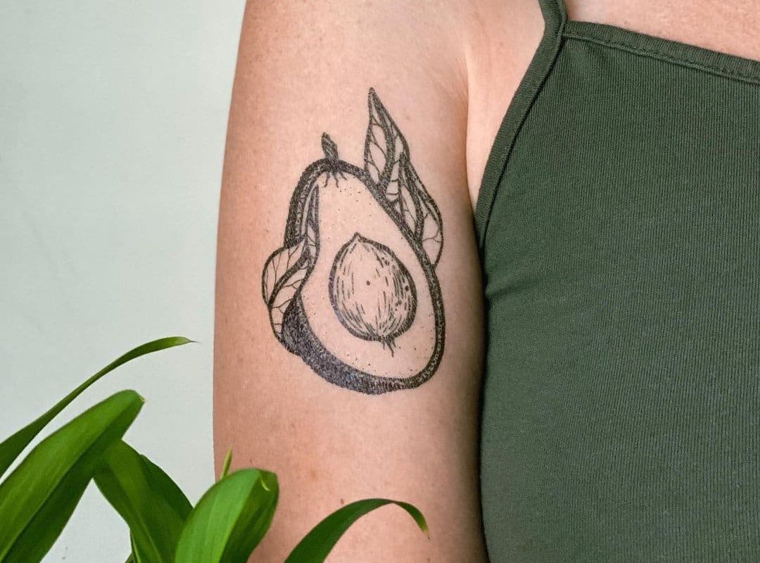Avocado tattoo on the bicep