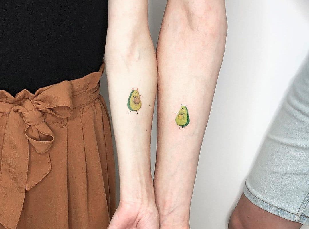 a guy and a girl got the same avocado tattoo