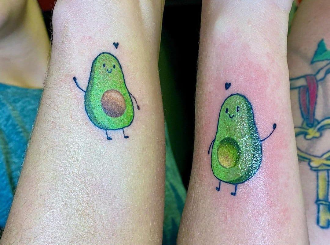 Friends have the same avocado tattoos on their arms