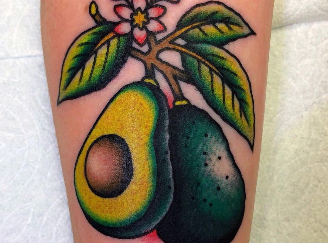 Tattoo with two avocados on a branch