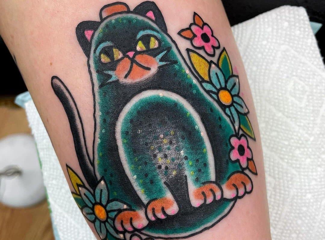 Avocado tattoo in the form of a cat