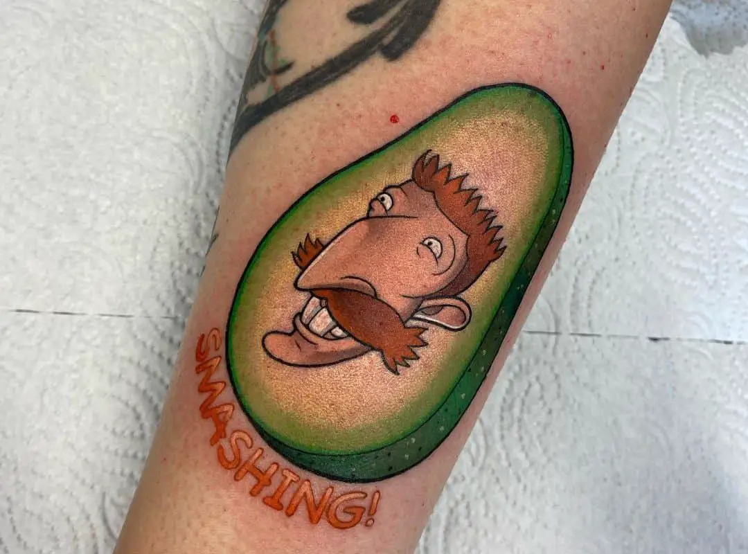 avocado with a- tattoo of cartoon character