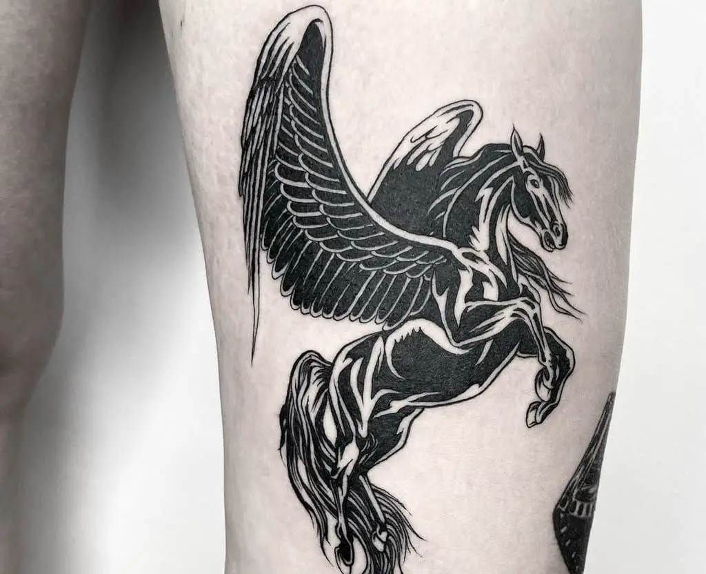 A tattoo of a black pegasus standing on end