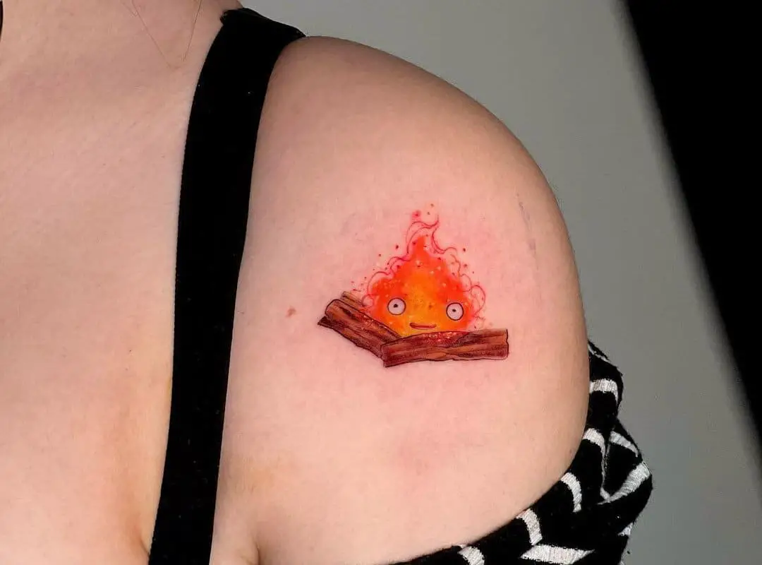 calcifer on two logs tattoo