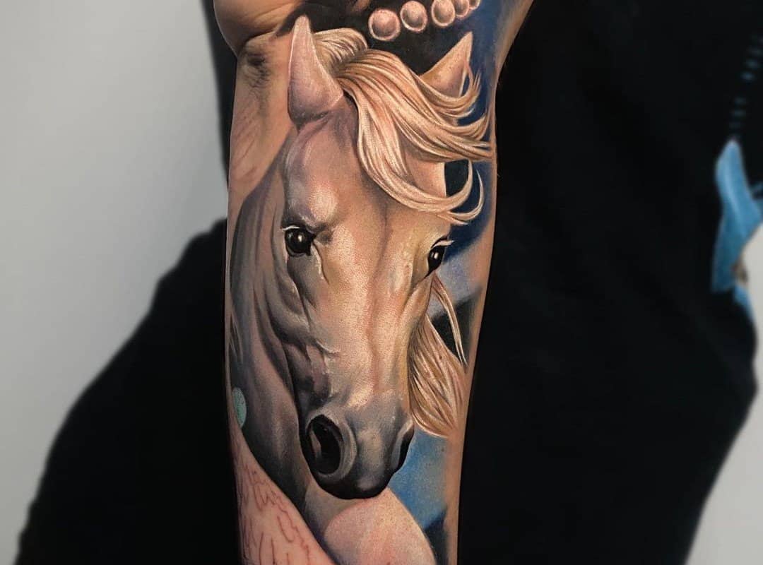 Color tattoo with a pegasus face