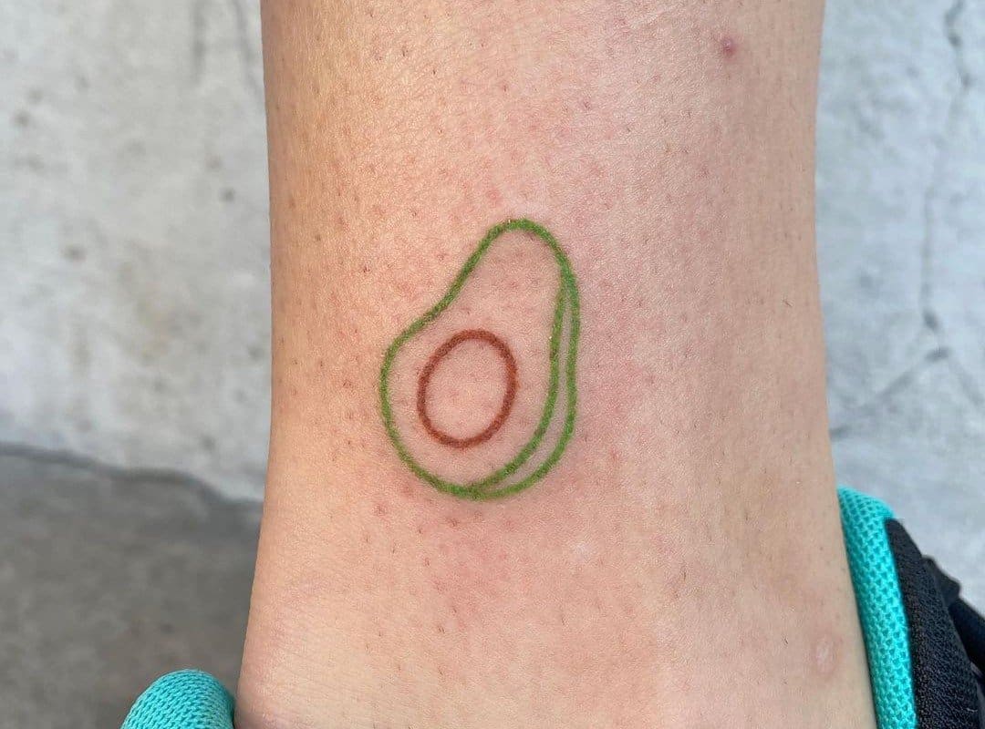 Avocado tattoo done in a minimalist way 