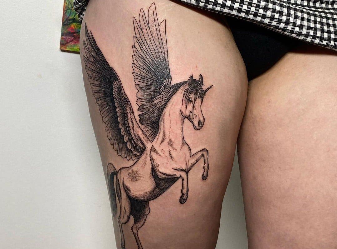 a tattoo with a pegasus at the moment of takeoff